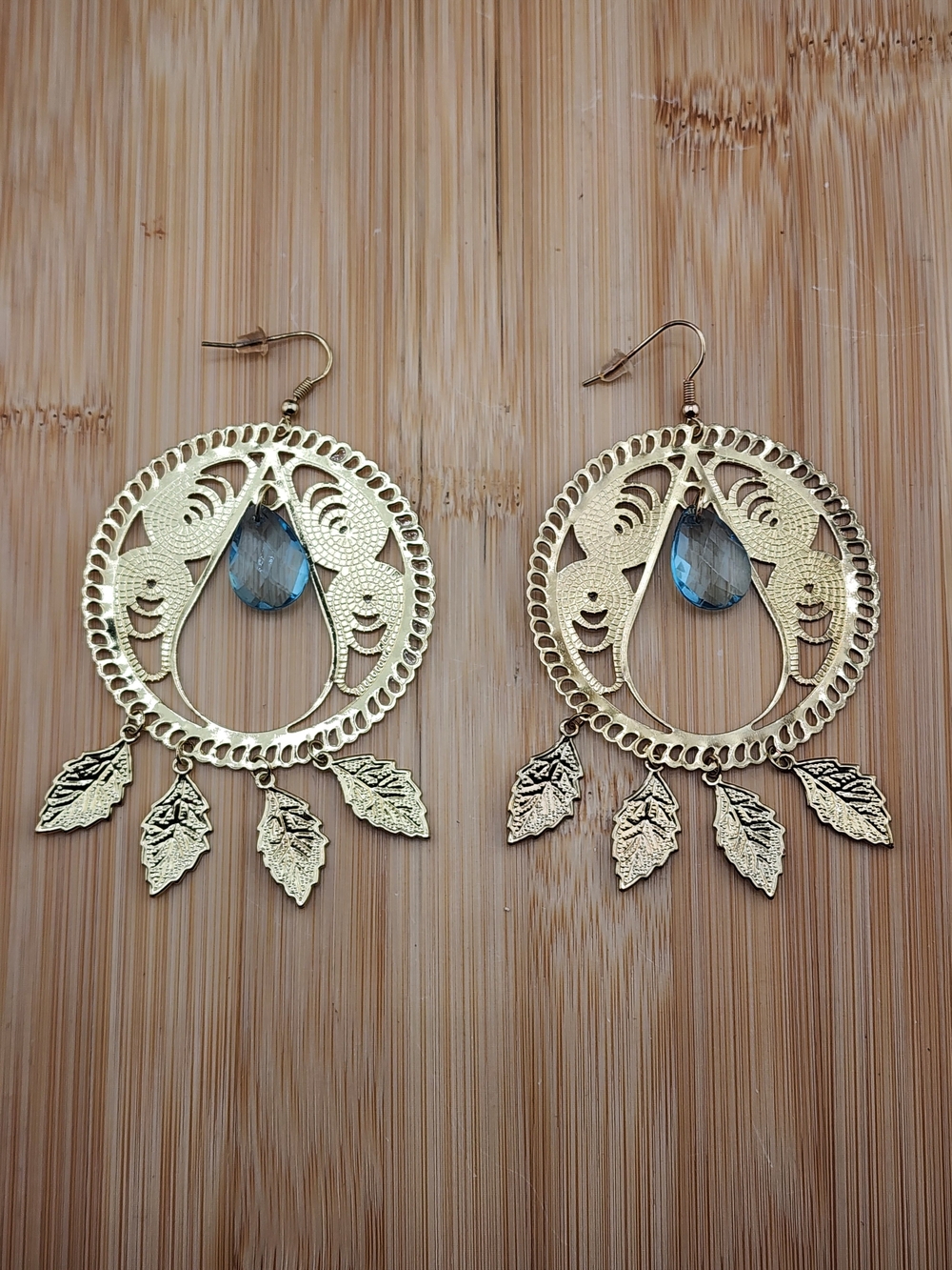 Gold Tone Filigree Leaf Drop Earrings with Blue Teardrop Accent 0643